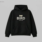Cream ribbon bow graphic on a black heavyweight hoodie.320gsm hoodie featuring BIRD VECTOR minimalist text